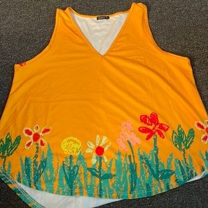 Sleeveless shirt. Size 3 XL. Bright yellow/orange color with design on bottom.